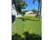 The expansive backyard is fully fenced and features a well-maintained lawn and ample space for recreation at 15101 Bald Eagle St, Tampa, FL 33625