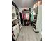 Walk-in closet with custom shelving and ample storage space at 15101 Bald Eagle St, Tampa, FL 33625
