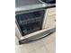 Modern stainless steel dishwasher with the door opened to show the interior racks at 15101 Bald Eagle St, Tampa, FL 33625