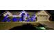 Well-manicured front yard and vibrant blue lighting highlight this beautiful home's curb appeal and architecture at 15101 Bald Eagle St, Tampa, FL 33625