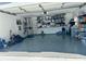Expansive two-car garage boasts epoxy flooring and ample wall storage solutions for organization and convenience at 15101 Bald Eagle St, Tampa, FL 33625