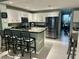 Bright kitchen featuring stainless steel appliances, granite countertops and barstool seating at 15101 Bald Eagle St, Tampa, FL 33625