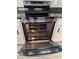 Modern oven with open door displaying interior racks and clean design at 15101 Bald Eagle St, Tampa, FL 33625