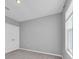 Neutral bedroom featuring a double door closet and natural light from the bright window at 16972 Oval Rum Dr, Wimauma, FL 33598