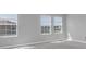 Bedroom filled with sunlight from the large windows at 16972 Oval Rum Dr, Wimauma, FL 33598