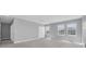 Large bedroom with carpeted floor, closet and windows at 16972 Oval Rum Dr, Wimauma, FL 33598
