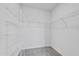Walk-in closet with white wire shelving, offering ample storage and organization at 16972 Oval Rum Dr, Wimauma, FL 33598