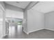 Welcoming entryway showcasing open living spaces and tile flooring at 16972 Oval Rum Dr, Wimauma, FL 33598