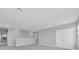 Hallway with railing, carpeted floor and natural light at 16972 Oval Rum Dr, Wimauma, FL 33598