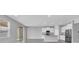 Open kitchen with granite countertops, stainless appliances, and breakfast bar at 16972 Oval Rum Dr, Wimauma, FL 33598