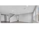 Spacious living room featuring staircase and natural light at 16972 Oval Rum Dr, Wimauma, FL 33598