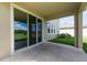 Covered outdoor patio with serene views, ideal for relaxation and entertaining at 16972 Oval Rum Dr, Wimauma, FL 33598
