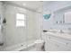Modern bathroom featuring a glass-enclosed shower, updated fixtures, and neutral tile flooring at 1712 Azalea Ct # B, Oldsmar, FL 34677