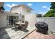 Outdoor patio with a dining table and chairs, offering a perfect space for entertaining with BBQ grill at 1712 Azalea Ct # B, Oldsmar, FL 34677