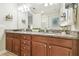 Bathroom featuring double sinks, granite countertop, and stylish fixtures at 17880 Althea Blue Pl, Lutz, FL 33558