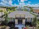 Aerial view showcasing a well-maintained clubhouse, landscaping, and community amenities at 17880 Althea Blue Pl, Lutz, FL 33558