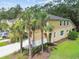 Inviting home with palm trees and landscaping, offering a comfortable and appealing curb presence at 17880 Althea Blue Pl, Lutz, FL 33558