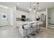 Spacious open kitchen with a large island, stainless steel appliances, and modern white cabinetry at 17880 Althea Blue Pl, Lutz, FL 33558