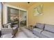 Relaxing screened patio with comfortable seating, ideal for enjoying the outdoor ambiance while offering an extended living area at 17880 Althea Blue Pl, Lutz, FL 33558