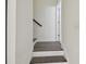 Stairway with wood flooring and white walls at 17880 Althea Blue Pl, Lutz, FL 33558