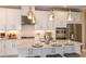 Modern kitchen featuring stainless steel appliances and a stylish island with seating at 1806 Longliner Loop, Wesley Chapel, FL 33543