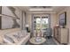 Stylish living room features neutral tones, modern decor, and a large window at 1806 Longliner Loop, Wesley Chapel, FL 33543