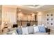 Upstairs loft area featuring a cozy seating area, neutral decor, and an open railing overlooking the lower level at 1806 Longliner Loop, Wesley Chapel, FL 33543