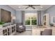 Stylish home office with a window, a built-in cabinet, and neutral tones at 1806 Longliner Loop, Wesley Chapel, FL 33543