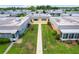 An aerial view of single story homes and mature lawns in a quiet neighborhood at 201 Bedford St # 79, Sun City Center, FL 33573