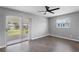 Bright bedroom with sliding glass door offering outdoor access and natural light at 201 Bedford St # 79, Sun City Center, FL 33573