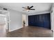 Spacious bedroom featuring a ceiling fan, wood floors, and a large closet with bi-fold doors at 201 Bedford St # 79, Sun City Center, FL 33573