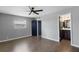 Bedroom with wood flooring, closet, and ensuite bathroom at 201 Bedford St # 79, Sun City Center, FL 33573