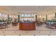 Spacious clubhouse with ample seating, tables, and a service bar, perfect for gatherings and events at 201 Bedford St # 79, Sun City Center, FL 33573