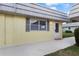 Charming condo featuring a neutral color scheme with matching door and a window with grey shutters at 201 Bedford St # 79, Sun City Center, FL 33573