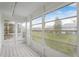Screened-in porch features windows, checkered floor, and natural light at 201 Bedford St # 79, Sun City Center, FL 33573