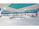 Large indoor pool area featuring a spa, seating areas and views from numerous windows at 201 Bedford St # 79, Sun City Center, FL 33573