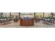 The lobby features many tables and chairs and several lush plants at 201 Bedford St # 79, Sun City Center, FL 33573