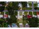 An aerial view of a well-maintained home in a quiet residential neighborhood with mature landscaping at 2123 Indigo Dr, Clearwater, FL 33763