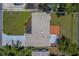 Aerial view of the property showing the roof, driveway, backyard, and surrounding landscape at 2123 Indigo Dr, Clearwater, FL 33763