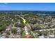 Scenic aerial view of home highlighting the neighborhood's proximity to the lake and amenities at 2123 Indigo Dr, Clearwater, FL 33763