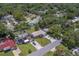Overhead view shows the house, neighborhood, well-manicured lawn and tropical landscaping at 2123 Indigo Dr, Clearwater, FL 33763