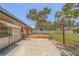 A wooden deck extends from a concrete patio into the yard, providing great outdoor entertaining opportunities at 2123 Indigo Dr, Clearwater, FL 33763