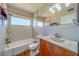 Updated bathroom features a modern vanity, stylish tile work, and a shower-tub combination at 2123 Indigo Dr, Clearwater, FL 33763