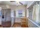 Bright kitchen with stainless steel refrigerator, table, and ample natural light at 2123 Indigo Dr, Clearwater, FL 33763