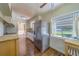 Kitchen featuring a stainless steel refrigerator, wood look flooring, and window at 2123 Indigo Dr, Clearwater, FL 33763