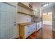 Kitchen featuring white cabinets, butcher block countertops, and stainless steel appliances at 2123 Indigo Dr, Clearwater, FL 33763
