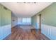 Inviting living area showcases wood-look tile floors, neutral paint, and natural light at 2123 Indigo Dr, Clearwater, FL 33763