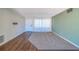 Neutral living area features tile flooring, carpet insert, and well-lit, airy space at 2123 Indigo Dr, Clearwater, FL 33763