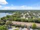 Enjoy this aerial view of the building, highlighting lake views and the surrounding mature landscaping at 2192 Swedish Dr # 26, Clearwater, FL 33763