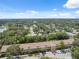 An aerial view of the community surrounded by lush greenery and a meticulously kept landscape at 2192 Swedish Dr # 26, Clearwater, FL 33763
